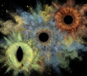 Powerful "Iris Art online" artwork: three human eye irises (blue, brown, yellowish) unleashed into a dramatic brown, blue, and yellowish dust explosion against a black background. This meaningful piece is part of the iris art online collection, symbolizing freedom, energy, and transformation. Order your online iris art now.