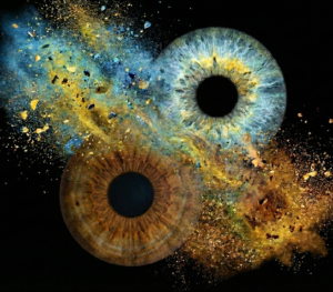 Dramatic "Iris Photography" composition "Chaos & Grace": three human eye irises (blue, brown, light grey) surrounded by a spectacular, contrasting smoke and dust explosion effect against a black background. This iris art online piece symbolizes spiritual searches and the merging of soul fragments. The online iris service allows you to order such personalized artworks online.