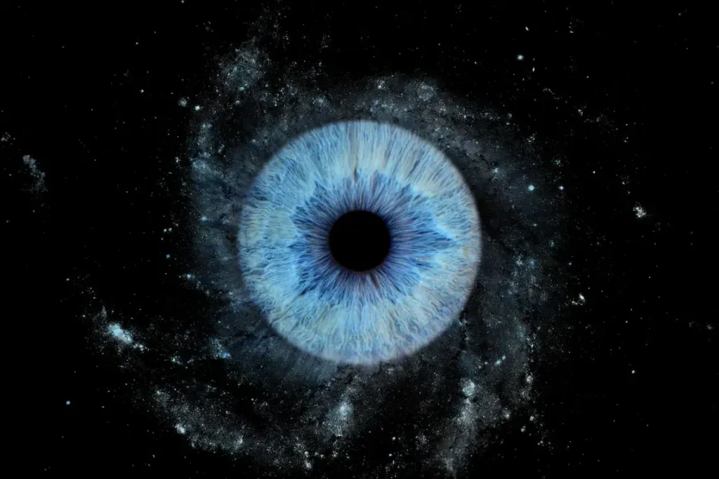Blue Nebula personalized single eye photography art featuring one real blue iris surrounded by a deep cosmic nebula effect on black.
