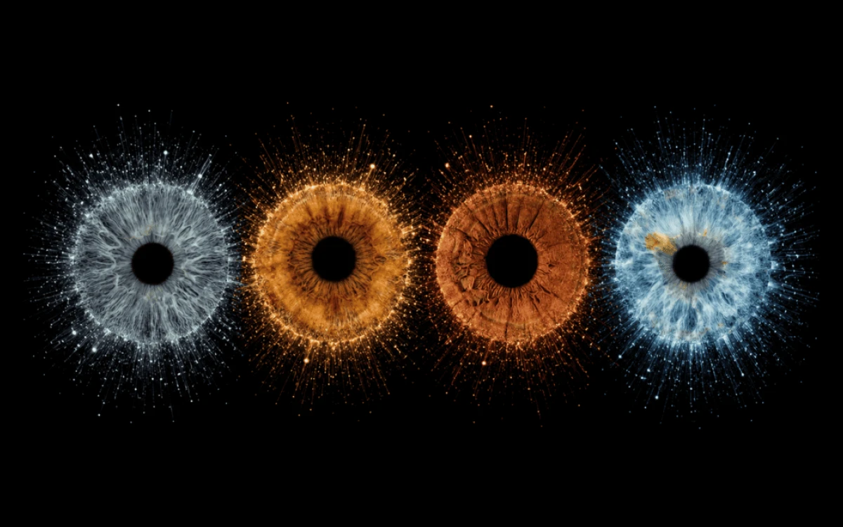Stardust Kinship custom four iris photography artwork featuring four family eyes glowing through blue and golden stardust on black.