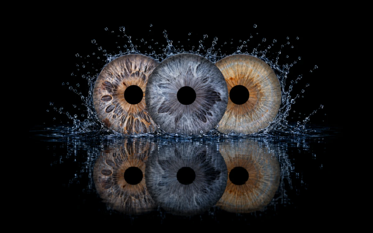 Three in the Current custom eye photography artwork featuring three family irises surrounded by realistic water splashes and reflections.